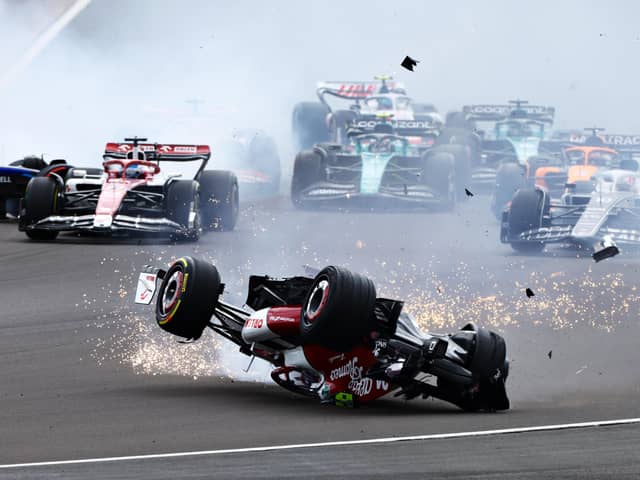 Zhou Guanyu of China driving the (24) Alfa Romeo F1 C42 Ferrari crashes at the start during the F1 Grand Prix at Silverstone. (Photo by Mark Thompson/Getty Images)