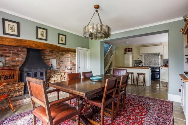 At the heart of this stylish home is a stunning kitchen of handmade painted timber and a central island unit. A place to entertain, to cook and to eat itopens to the dining area with inglenook fireplace with log burner and impressive views over the garden from the large bay window