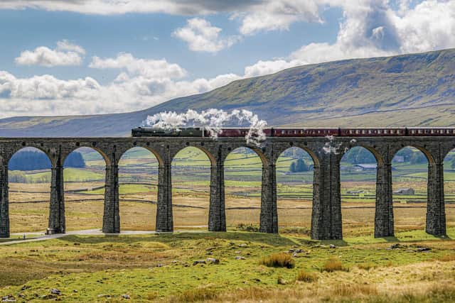 A steam train over the Ribblehead Viaduct on the Settle-Carlisle line. Picture: Tony Johnson.