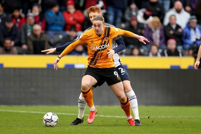Hull City's Tom Eaves - pictured in action for Hull battling with Preston North End's Sepp van den Berg at the MKM Stadium last season. Picture: Richard Sellers/PA