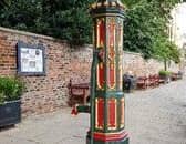 The brightly painted Gothic pump was used to supply a stone water trough until the 1940s