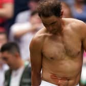 Painful blow: Rafa Nadal struggled with an abdominal injury during his quarter-final win. Picture: Adam Davy/PA Wire.