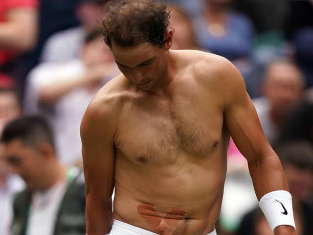Painful blow: Rafa Nadal struggled with an abdominal injury during his quarter-final win. Picture: Adam Davy/PA Wire.
