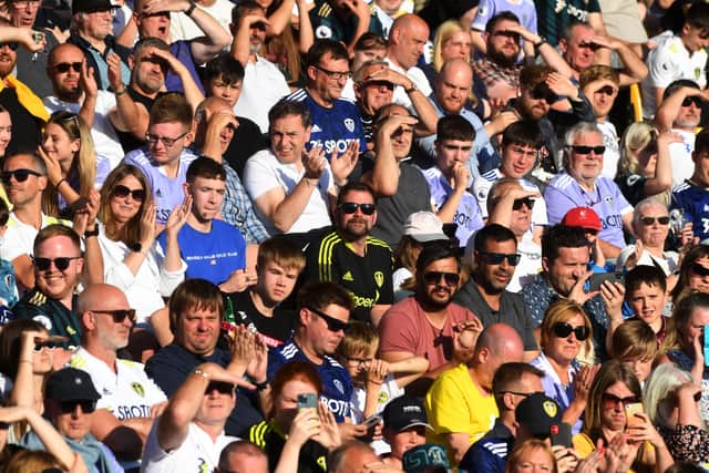 United's fans enjoy the sunshine. Picture: Jonathan Gawthorpe