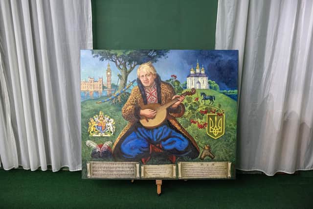 The painting of Boris Johnson dressed as a Ukrainian cossack by Ukrainian artists Daria Dobriakova and Yurii Kutilov assigned by Andrii Lisovyi in Chernihiv Historical Museum on July 8, 2022 in Chernihiv, Ukraine. (Photo by Alexey Furman/Getty Images)