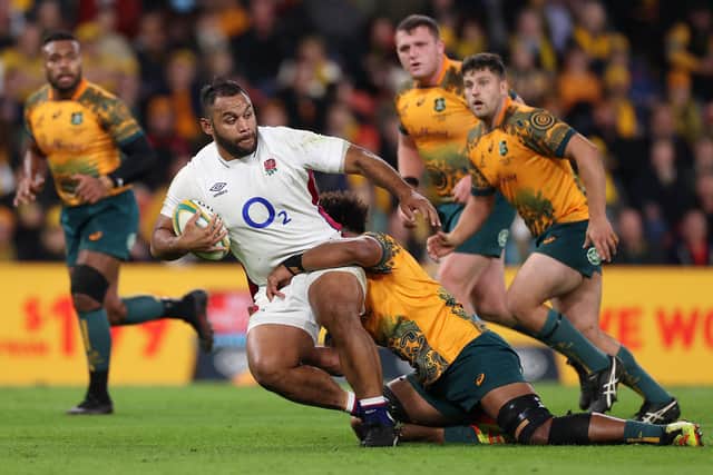 Rampaging run: Billy Vunipola, who scored England’s only try, is tackled by Rob Valetini of Australia in Brisbane. (Picture: Cameron Spencer/Getty Images)