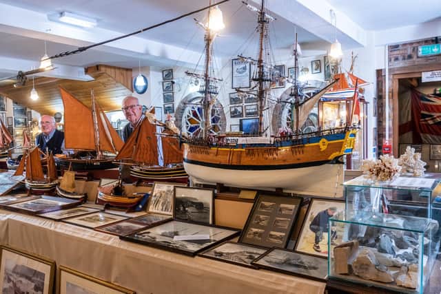 Colin Pyrah OBE (Heritage/museum consultant and trustee member), with volunteer David Willmott looking over some of the hundreds and hundreds of artefacts at the Staithes Story.