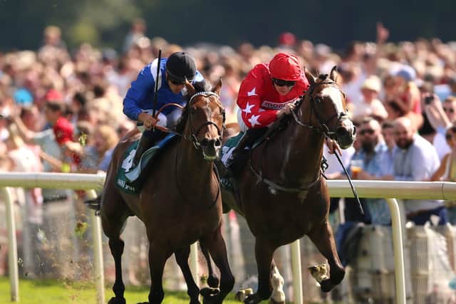 On top: Anmaat (left) ridden by Kevin Stott wins The John Smith's Cup on the Knavesmire. Picture: Nigel French/PA Wire.