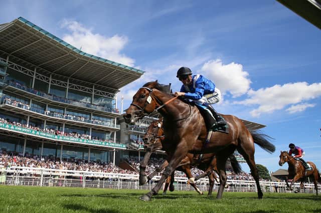 Cheers! Anmaat ridden by Kevin Stott wins The John Smith's Cup at York. Picture: Nigel French/PA Wire.