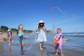 A family enjoy the hot spell at Scarborough North Bay on Sunday July 10 [Image: Richard Ponter]