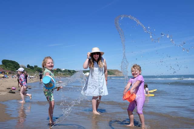 A family enjoy the hot spell at Scarborough North Bay on Sunday July 10 [Image: Richard Ponter]
