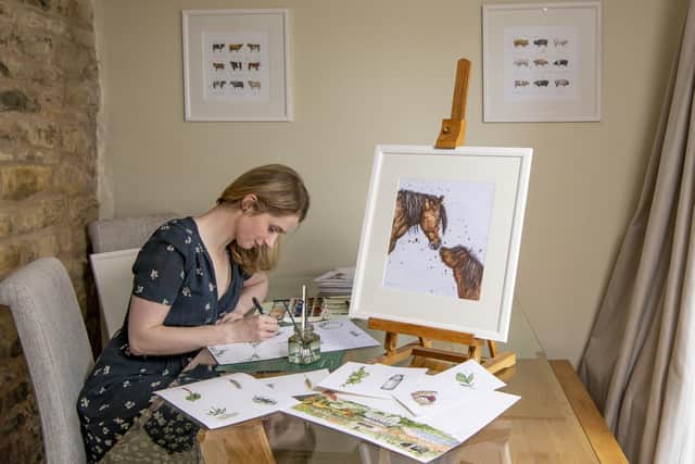 Eleanor Tomlinson working on an illustration at her home near Brough