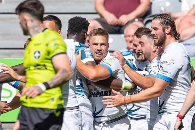 Toulouse Olympique celebrate Matty Russell's try. (Picture: SWPix.com)
