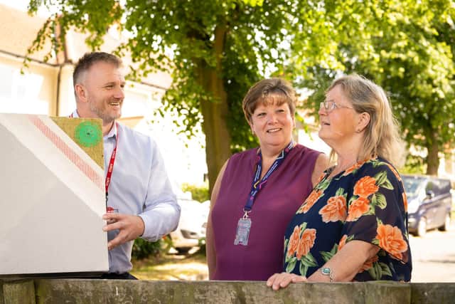 (left to right) Mark Richards, E.ON and Gina Sawley, Yorkshire Housing, with Sarah Wardle, a Yorkshire Housing customer whose home is part of the energy efficiency upgrade project