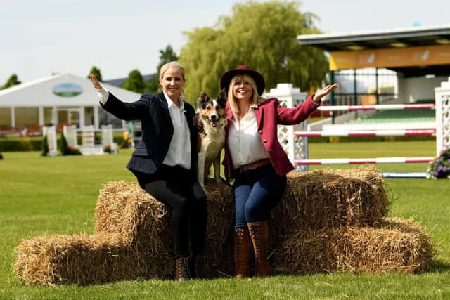 Presenter Christine Talbot (right) and Singer Lizzie Jones are pictured with the sheepdog called Moss in the Main Ring. Moss will be taking part in the show's first sheepdog trials.