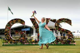 Courtney Huntley pictured in front of the Great Yorkshire Show Floral display which has been created by Jonathan Moseley.