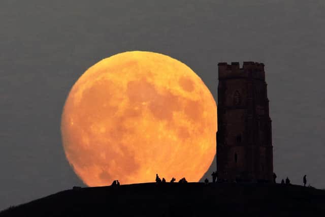 The Buck Moon rising over Glastonbury Tor in 2019