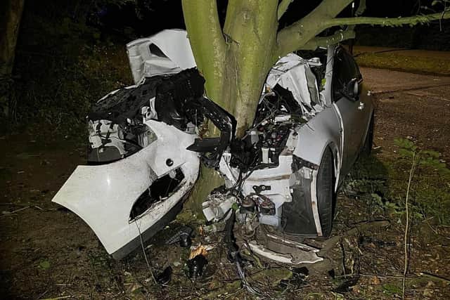The car was left wrapped around the tree