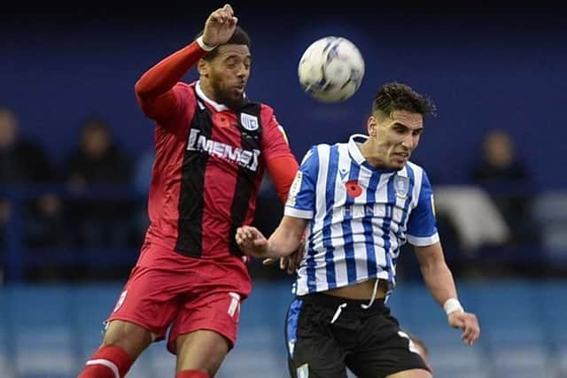 Vadaine Oliver, left, playing for Gillingham against the club where it all began for him, Sheffield Wednesday, last season (Picture: Steve Ellis)