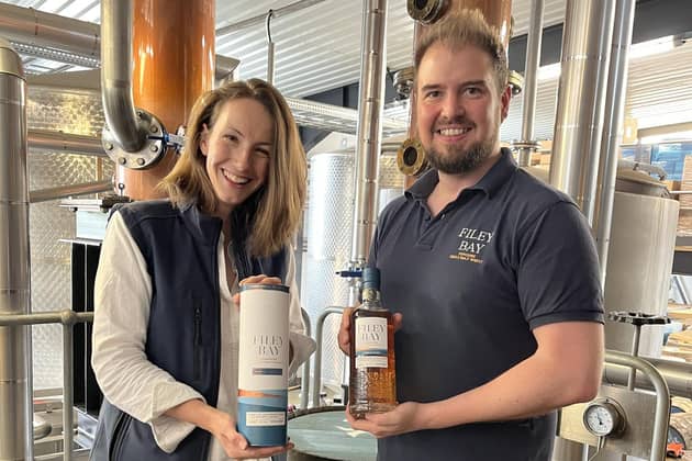 Jenni Ashwood and Joe Clark from Spirit of Yorkshire Distillery, inset, presented the whisky to Booths.