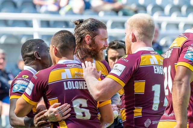 Huddersfield Giants celebrate Chris McQueen's try against Salford Red Devils. (Picture: SWPix.com)