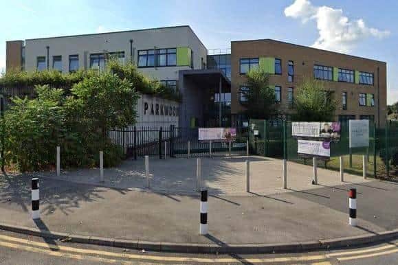 An angry dad has told how his son was among children sent home for wearing shorts at Parkwood Academy, pictured, during the heatwave.