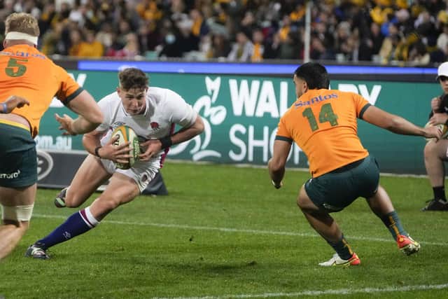 England's Freddie Steward runs at Australia's Tom Wright, right, on his way to scoring a try at the Sydney Cricket Ground in Saturday's third Test Picture: AP/Mark Baker