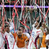 England's captain Courtney Lawes holds up the Ella-Mobbs Cup as the team celebrates their Test series win over Australia in Sydney Picture: AP/Rick Rycroft