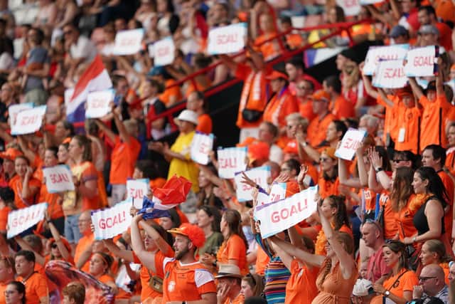 Oranje army: Netherlands fans in the stands celebrate a goal at Bramall Lane. Picture: Zac Goodwin/PA Wire.