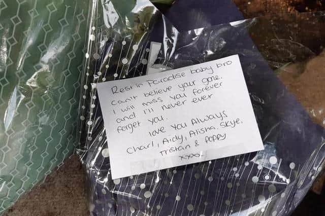 A heartbroken mum has told of the hardworking son and dad, Ricky Davies, who died tragically yards from his Sheffield home on Saturday morning. PIcture shows one of the tributes to Ricky at a shrine set up in his memory on a bridge over the Short Brook