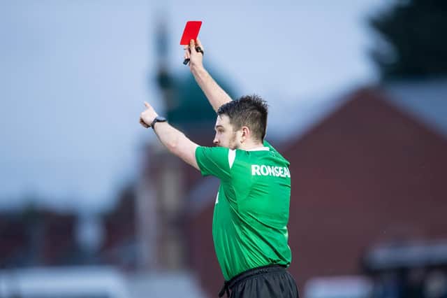Referee Marcus Griffiths issues a red card. (Picture: SWPix.com)