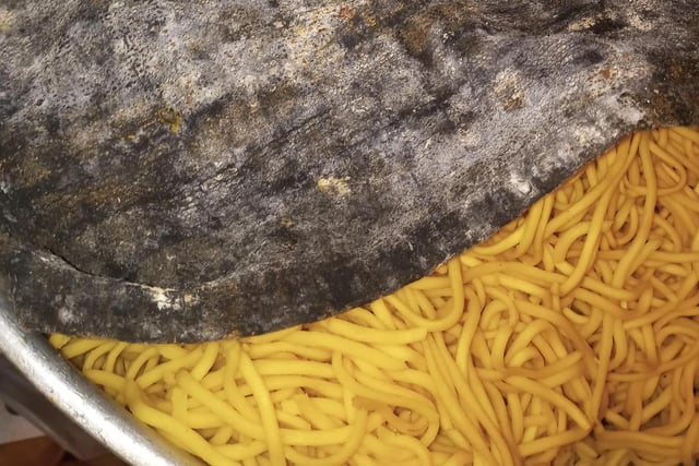 A dirty cloth covers a bowl of noodles