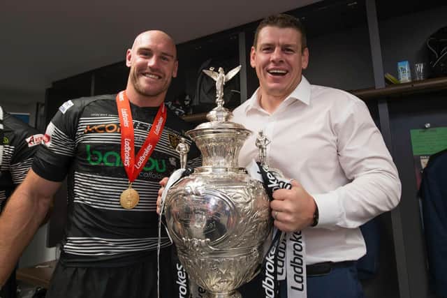 Lee Radford, right, holds the trophy alongside current Hull FC assistant coach Gareth Ellis. (Picture: SWPix.com)