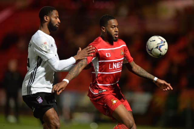 Doncaster Rovers' Reo Griffiths holds the ball from Ipswich Town's Janoi Donacien Picture: Bruce Rollinson
