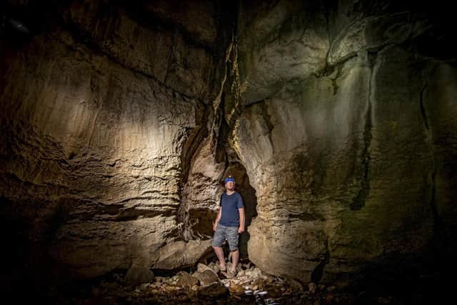 Dan Liddy from How Stean Gorge pictured in Tom Taylors cave on site. Picture Tony Johnson