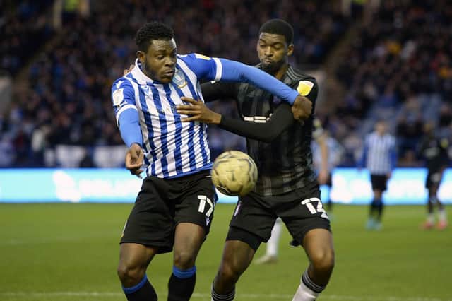 Sheffield Wednesday's Fisayo Dele-Bashiru holds off Ipswich's Tyreeq Bakinson, who has now joined the Owls.   Picture: Steve Ellis