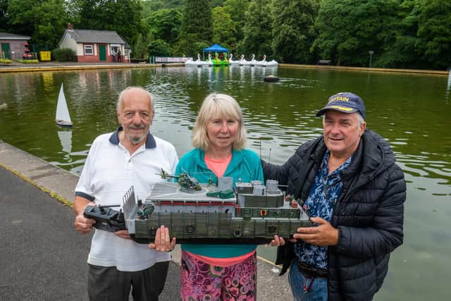 Malcolm Senior, Chairman of the Sheffield Ship Model Society, with, members Louise Turner, and James Crowfoot, holding a model Vietnam model gunboat belonging to Louise.