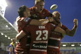 Hull KR's Ethan Ryan celebrates scoring their fourth try with team mates. Picture: Ed Sykes/SWpix.com