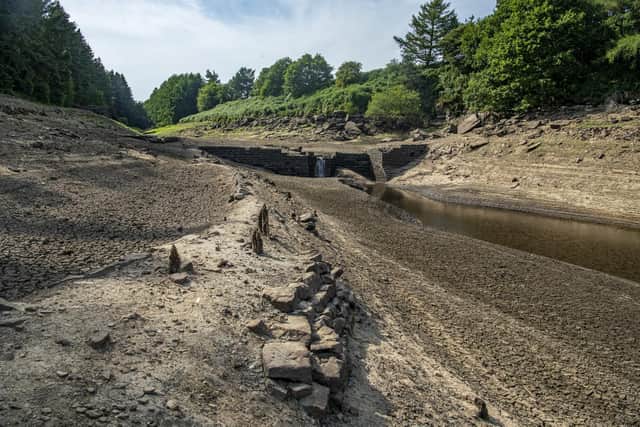 The submerged walls of buildings and boundary walls as well as the stumps of felled trees emerge from the low water levels at Thruscross Reservoir near Harrogate as the long spell without significant rainfall continues. Picture Tony Johnson