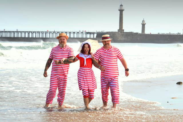 Steampunks in the sea. Pictured from the left are Mark Worley, Dawn Moss and Neil Perry on Whitby beach while they attend Whitby Steampunk Weekend ..Picture by Simon Hulme 23rd July  2022