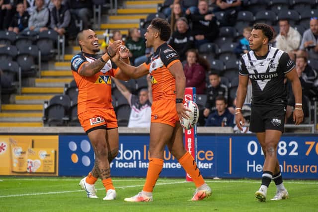 Derrell Olpherts celebrates one of his tries with Mahe Fonua. (Picture: Bruce Rollinson/YP)