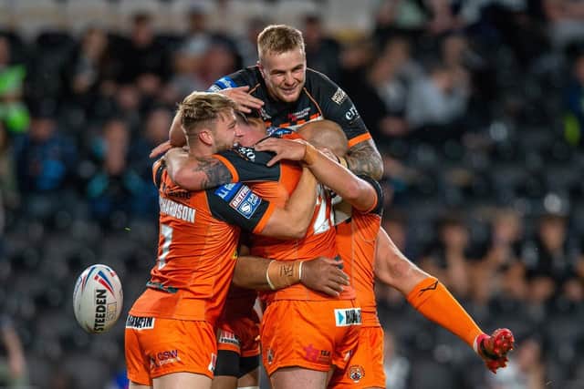 Castleford Tigers celebrate one of their eight tries. (Picture: Bruce Rollinson/YP)