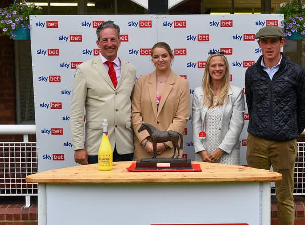 Winner: From left: Mark, Charlotte and Clare Oglesby from Goldsborough Hall present the Byerley Turk trophy for the leading trainer to Rory Bevin who was representing Tim Easterby. Picture: Hannah Ali