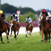 Winning run: Kyprios ridden by Ryan Moore (second right, red helmet) passes Stradivarius ridden by Andrea Atzeni (left, yellow helmet) on their way to winning the Al Shaqab Goodwood Cup Stakes. Picture: Adam Davy/PA Wire.