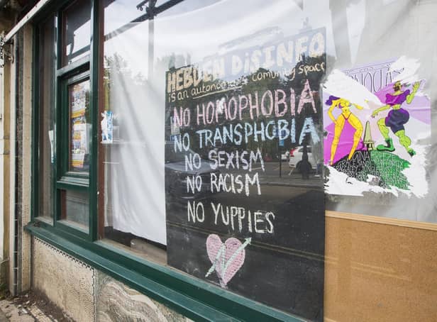 A sign in the window of the squat