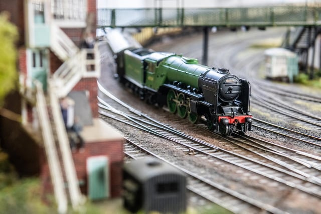 A train makes its way along the tracks on one of the layouts at Barnsley Model Railway Club.