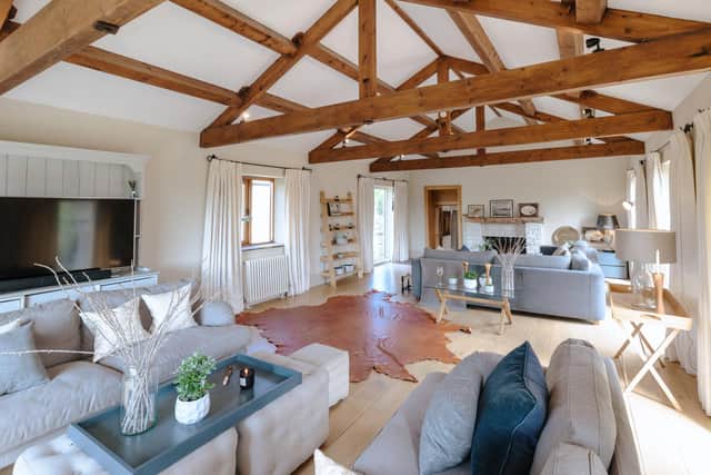 The original wooden beams are a key feature of Lodge Barn. The living space here has been zoned to provide relaxation areas that work well for large groups of guests.