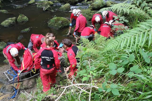 The difficult extraction of the casualty from the riverbank
