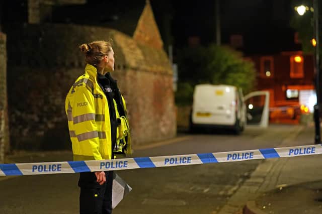 Police at the scene in Boston after a nine-year-old girl died from a suspected stab wound.