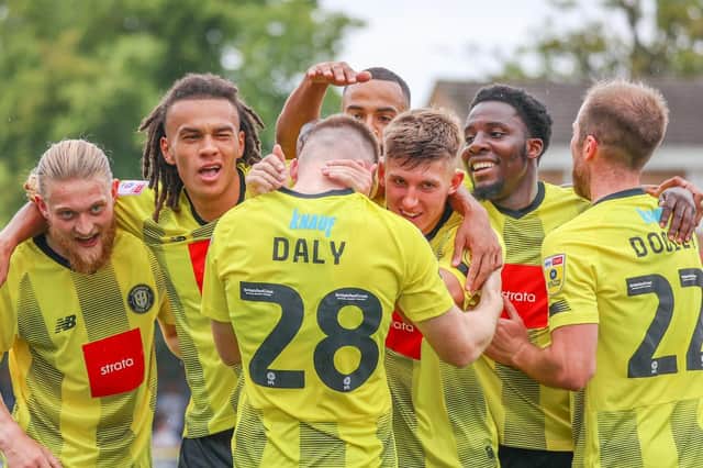 Harrogate Town celebrate after taking a 2-0 lead against Swindon Town on Saturday afternoon. Pictures: Matt Kirkham